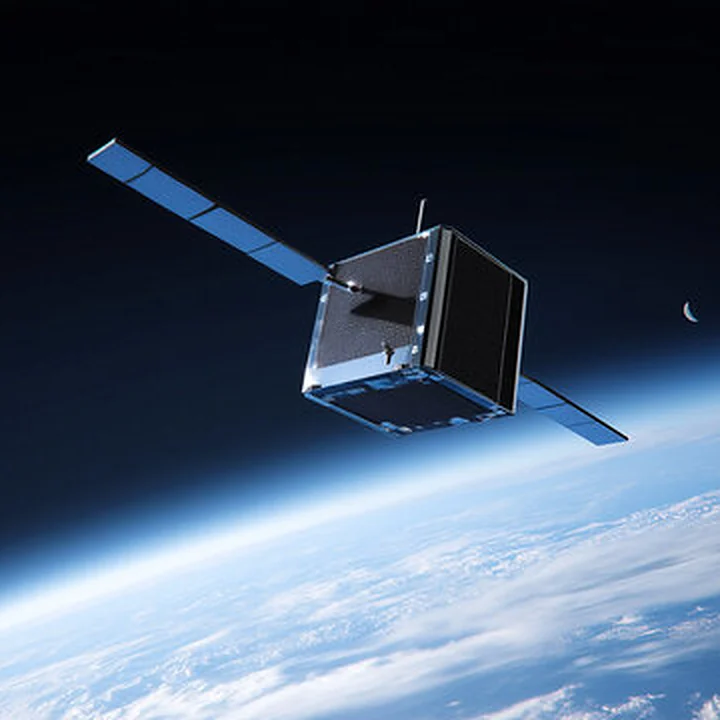 Small satellite in orbit above the Earth
