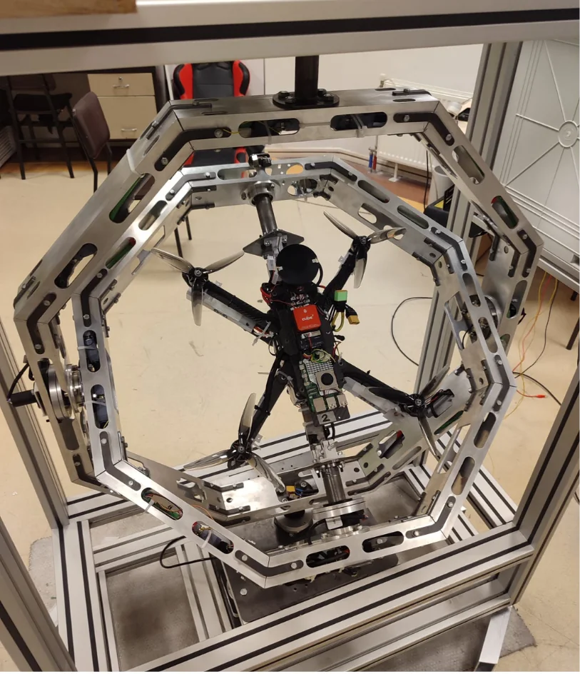UAV mounted to the roll-axis fixture inside the X1 rings